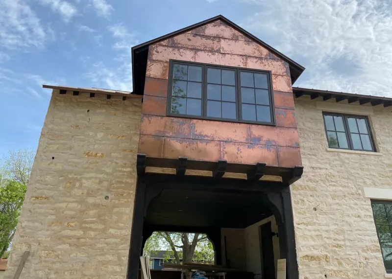 Copper metal panel facade on a stone building for Metal Roof Coating in Kaneohe Base
