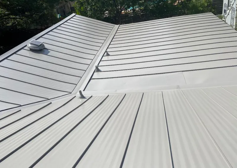 Solar attic fan installed on a metal roof for Roof Ventilation in Kaneohe Base