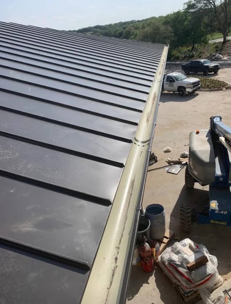 Standing seam panel and gutter detail on a metal roofing jobsite in Kaneohe Base